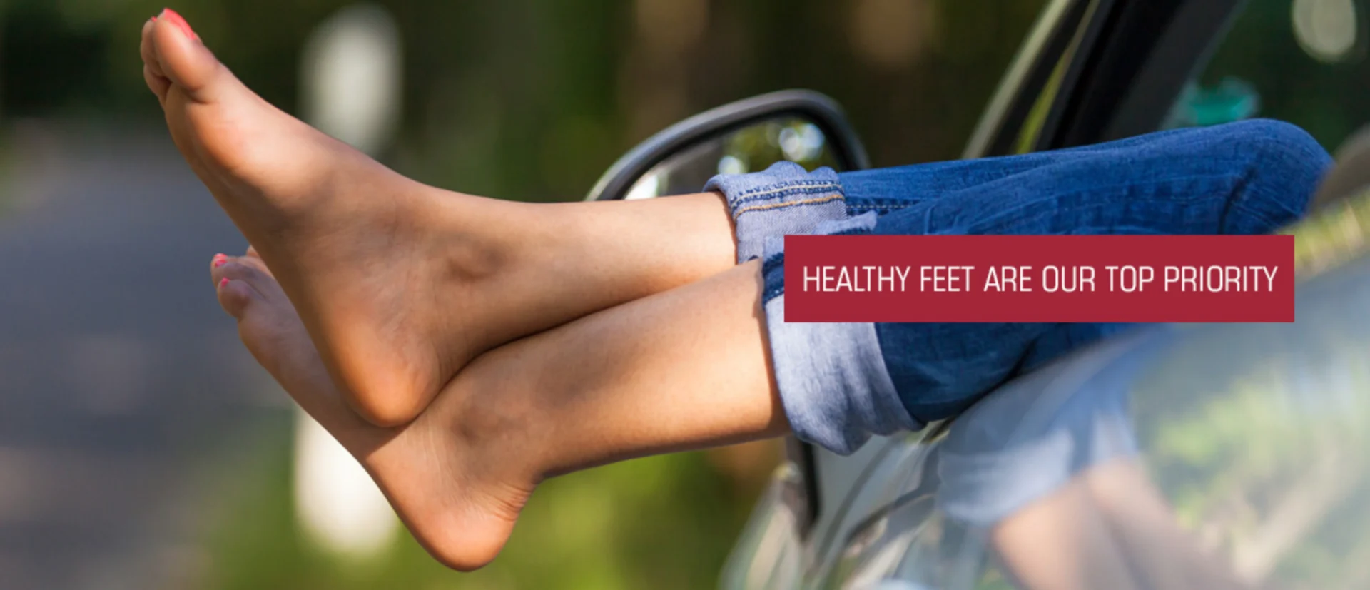 Person's legs on a vehicle with a blurred background and a watermark on the right side